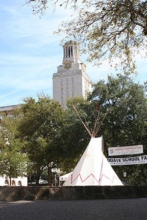 Native American dwelling (foreground) with UT Austin Tower (background)